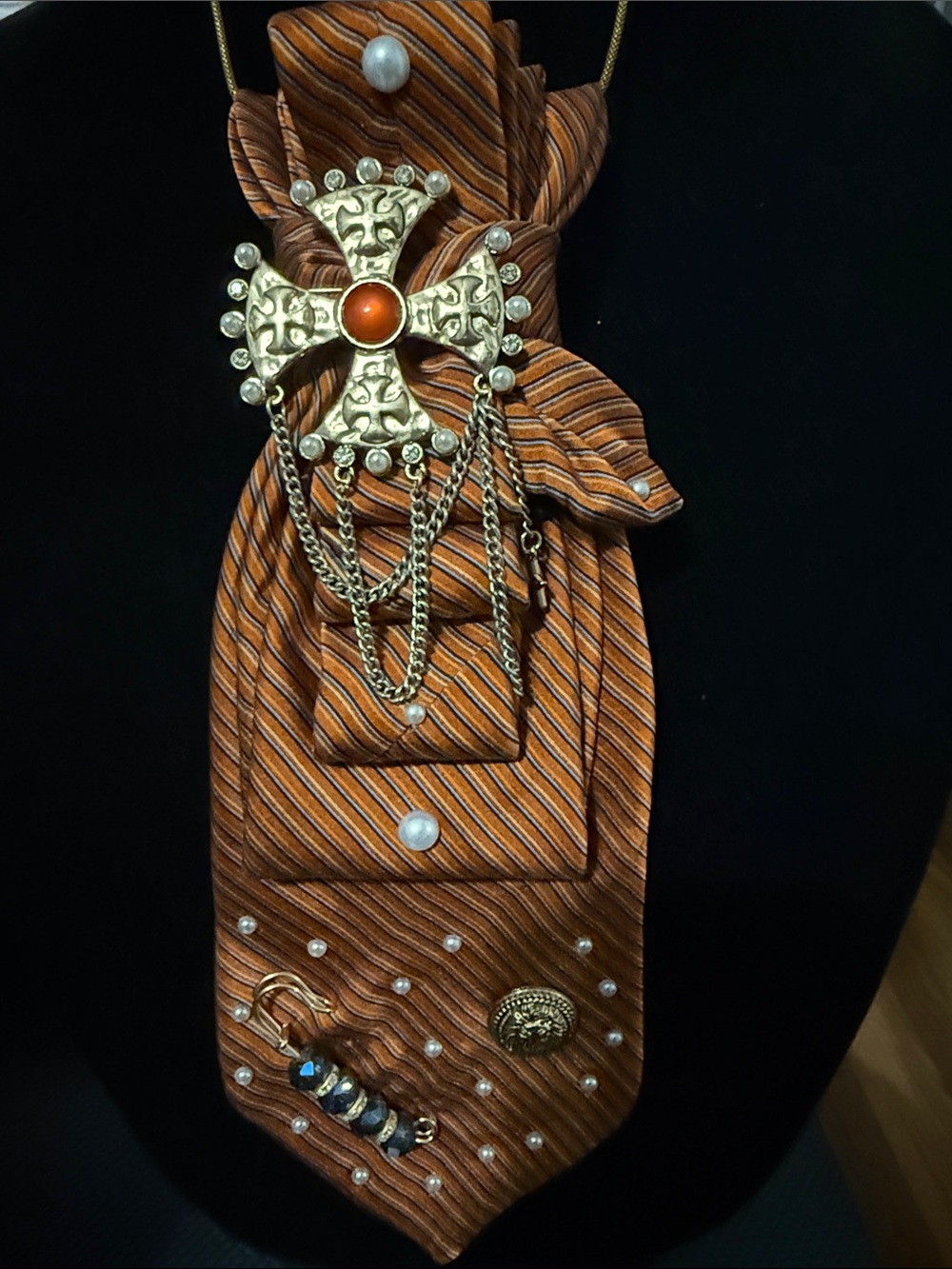 Gold-Tone Cross Brooch with Orange Striped Tie Accent